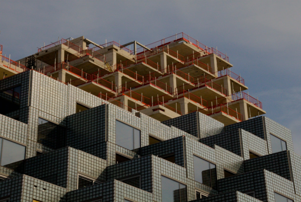 Industrial facility with emissions stacks, illustrating carbon capture technology in the built environment